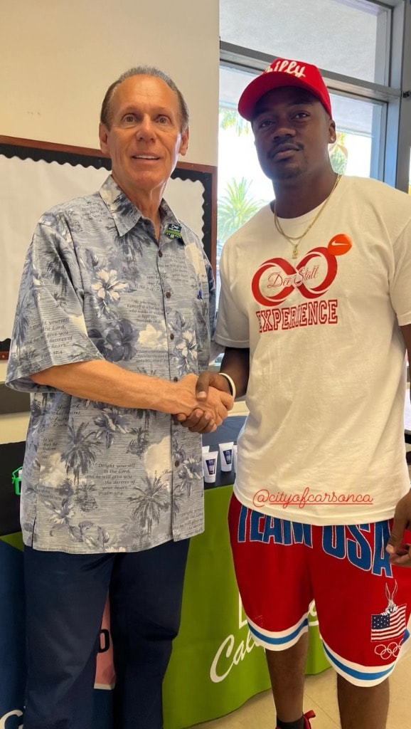 Dee Stallworth shaking hands with a community partner at the June 2024 event