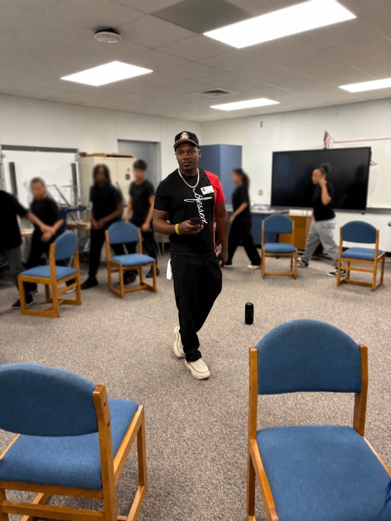 DSE facilitator walking among students during a school session